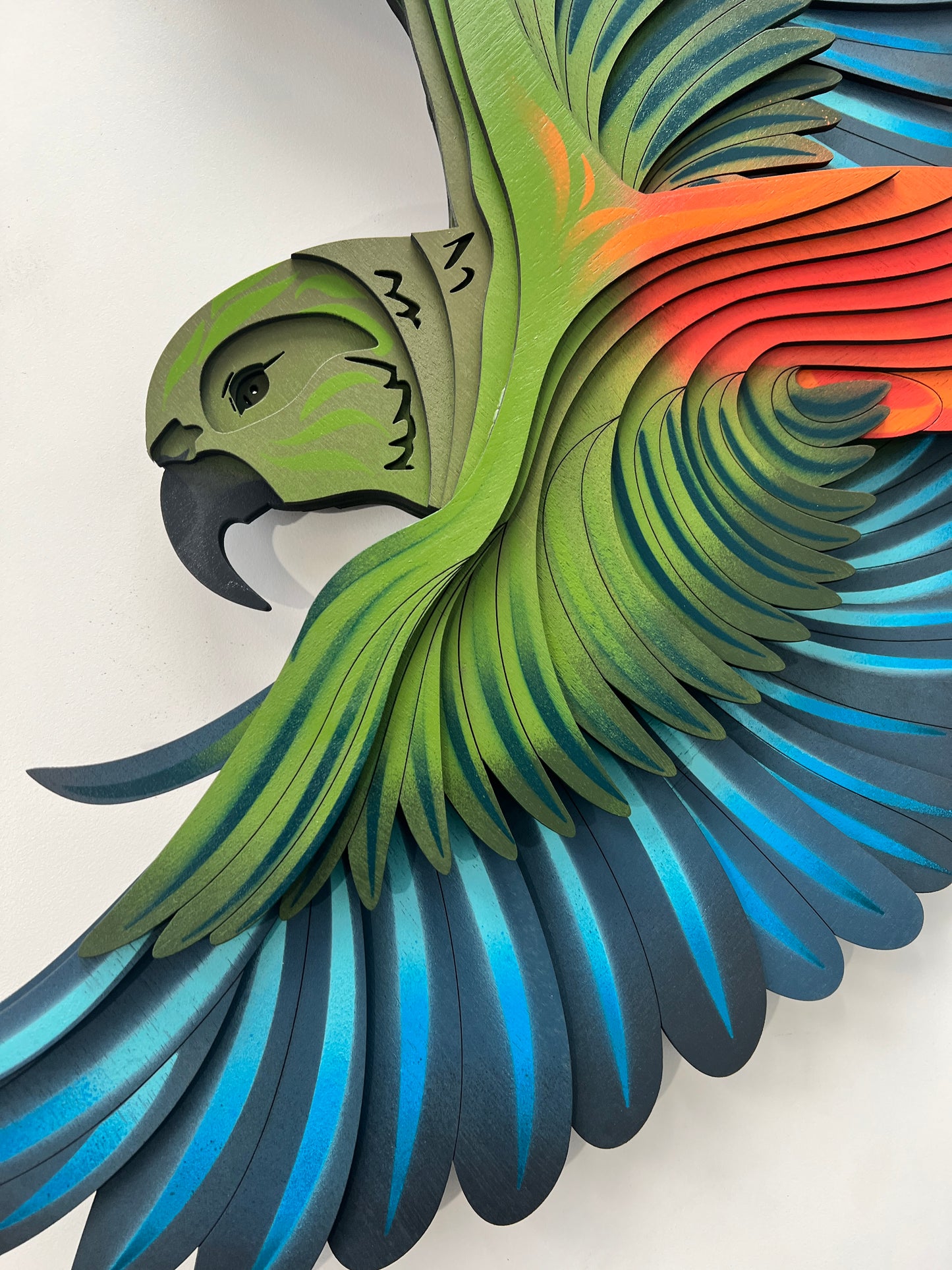 Close-up of Kea showing intricate feather detail and layered bamboo construction