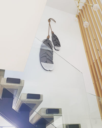 Huia feather wall art lifestyle shot showing scale and hanging display