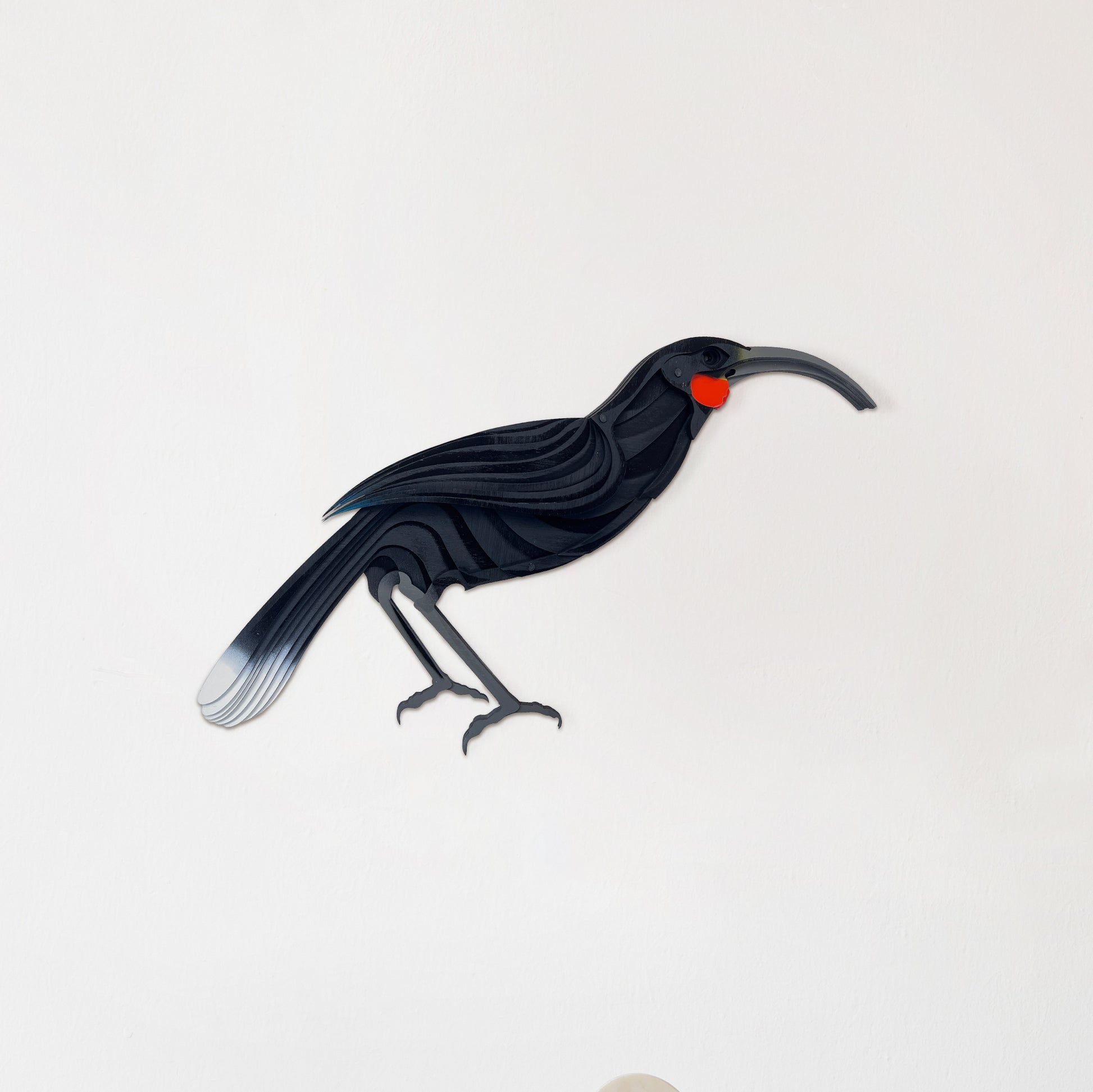 Hand-painted Huia bird wall art with black and white laser-cut bamboo detail