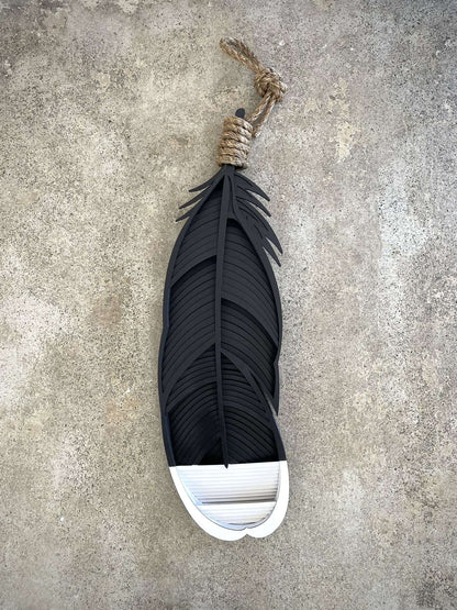 Huia feather wall art close-up showing intricate painted detail