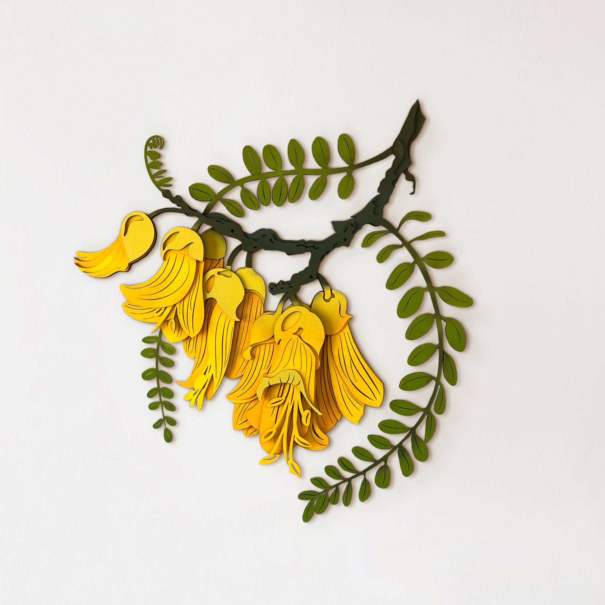 Bright yellow Kōwhai flower wall art with laser-cut bamboo petal
