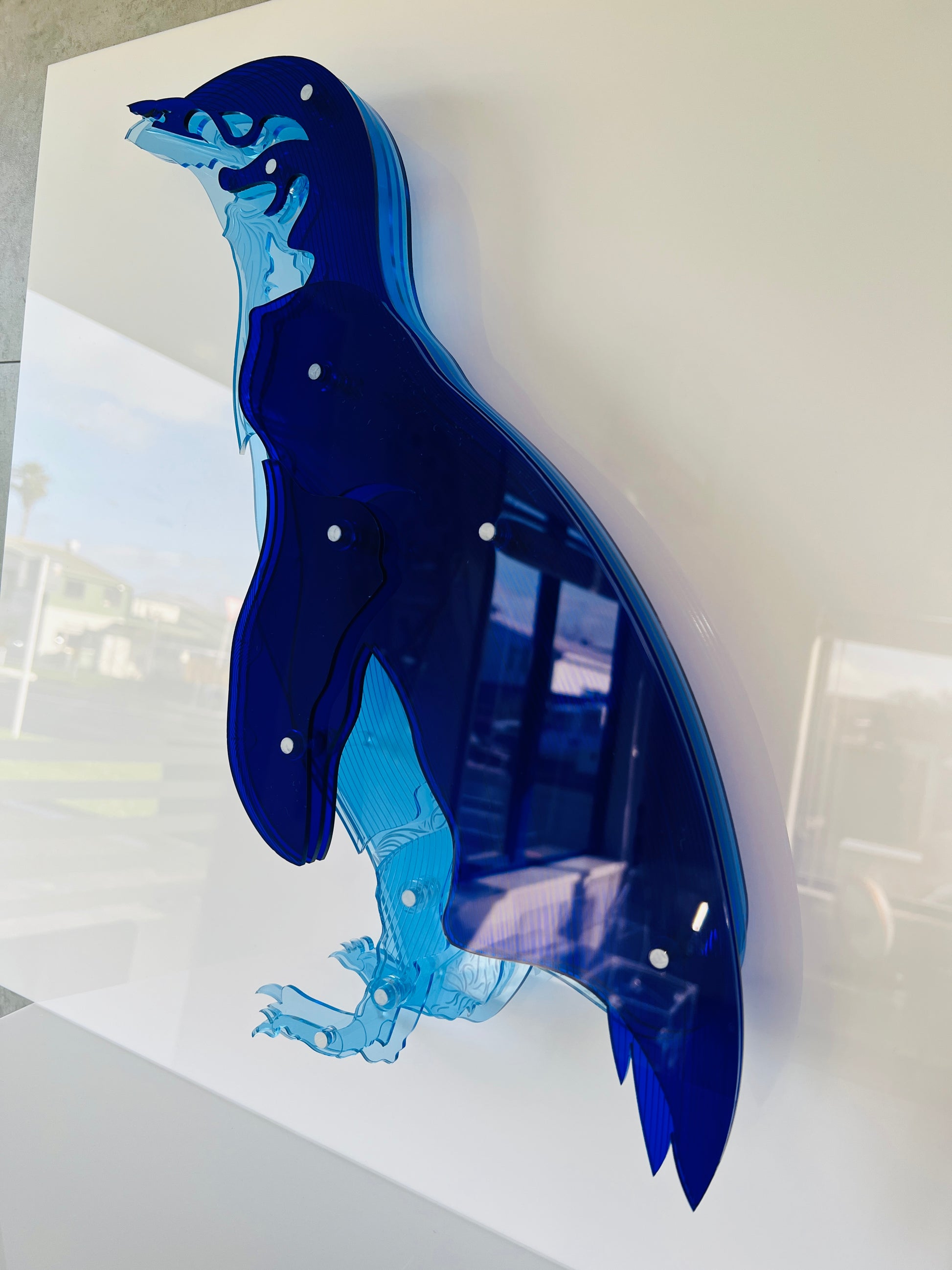 Blue Penguin 3D art showing vibrant blue layered Perspex