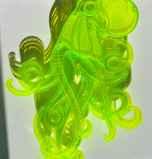 Bright neon green Octopus 3D wall art with layered acrylic in display case