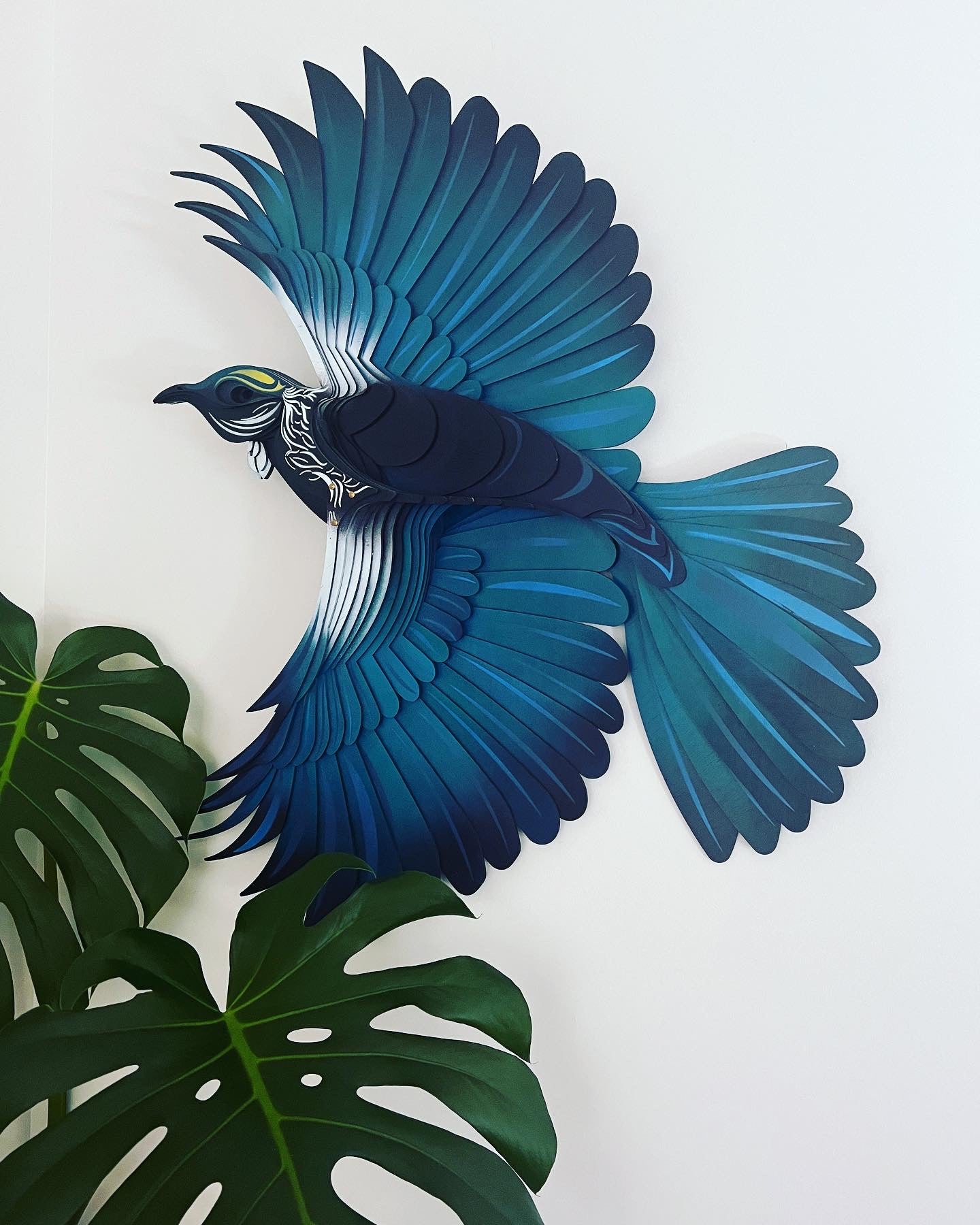 Tui bird wall art detail showing hand-painted feather texture and colors
